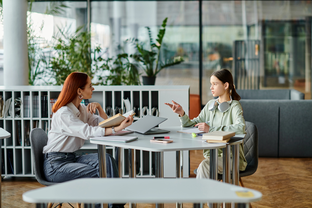 Mentor coaching a student through an online video call